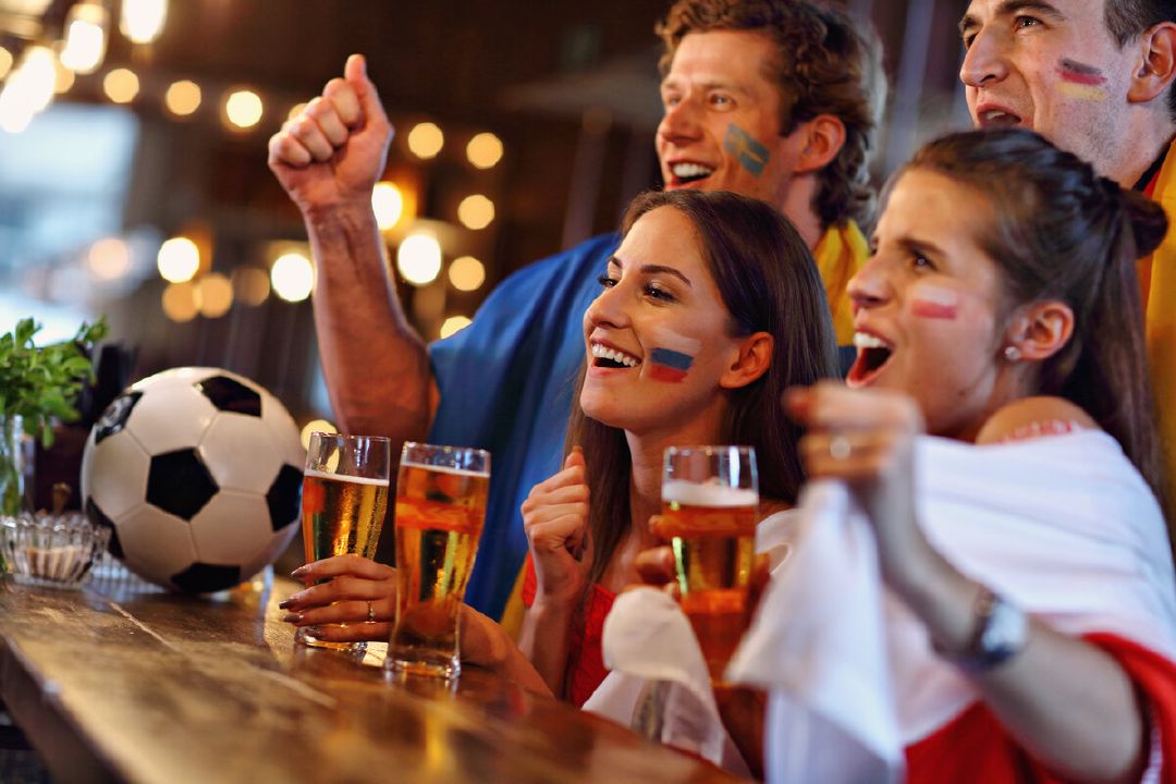 images/group-friends-watching-soccer-game-pub.jpg